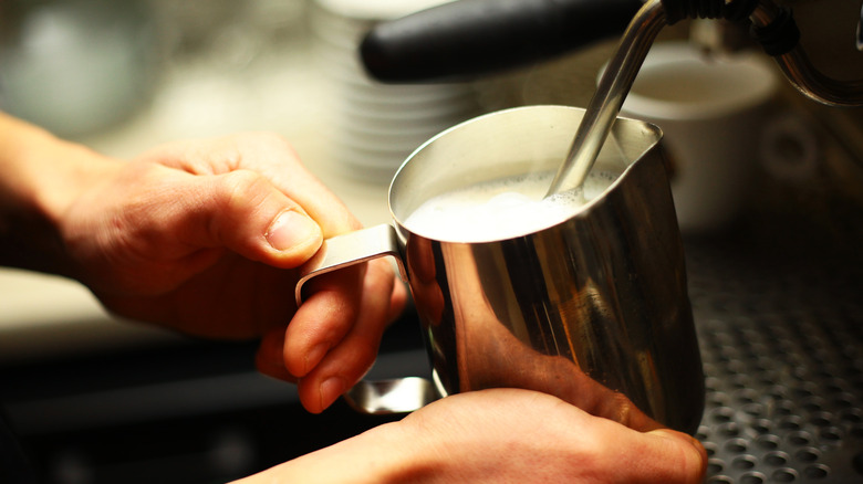 frothing milk in cup