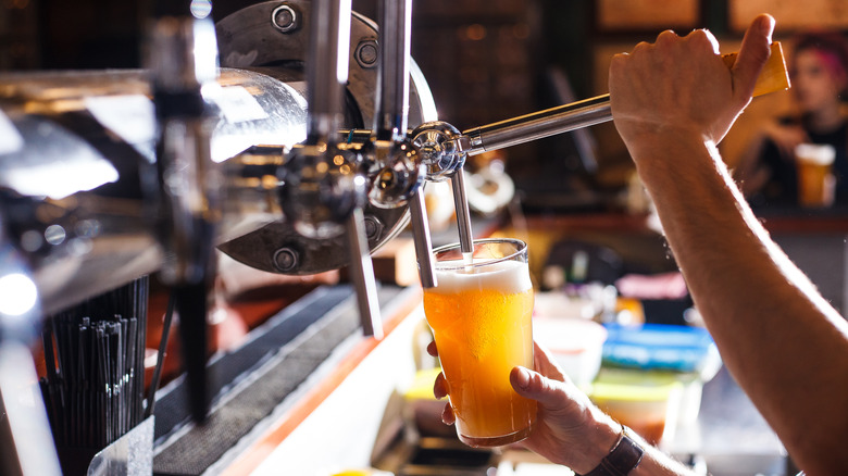 handing pulling beer tap handle