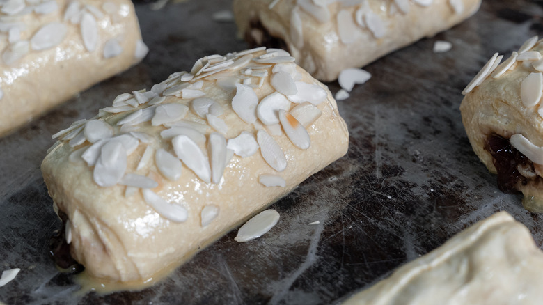 Almond-topped desserts in oven