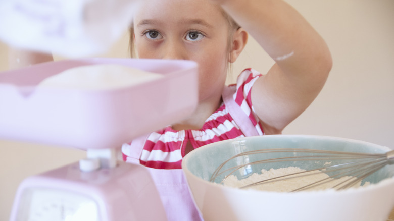 Child mixing in sugar