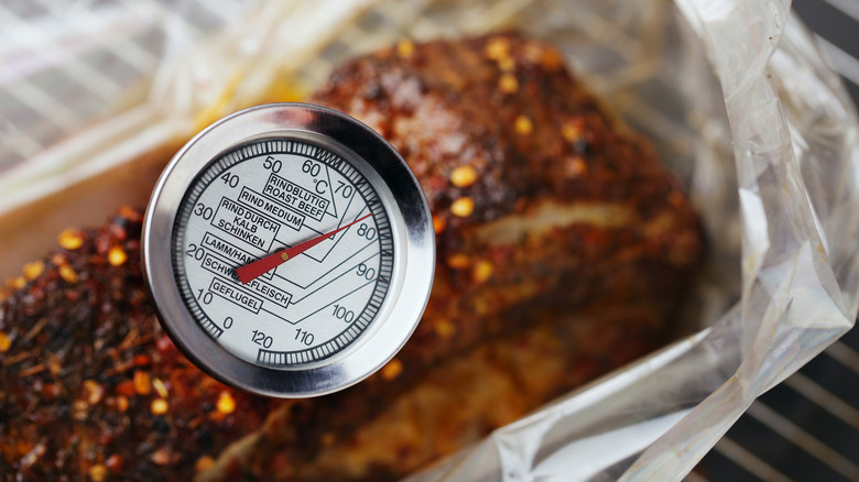 meat thermometer in roast beef