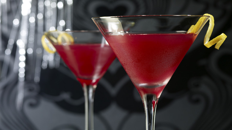 cosmopolitans with lemon twist garnish