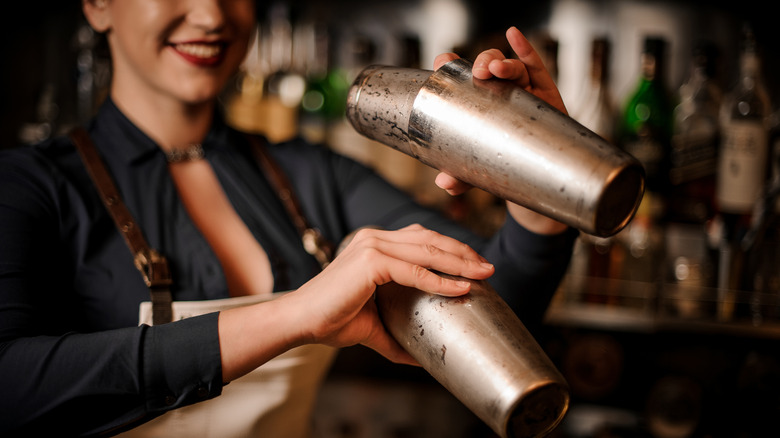 bartender shaking two cocktails