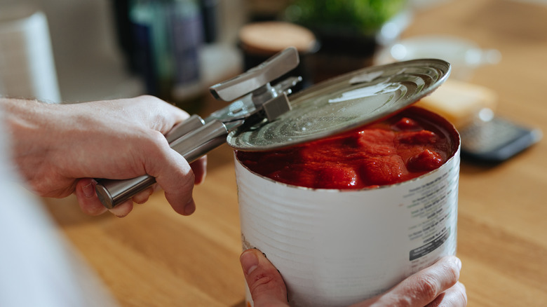 Opening a can of tomatoes