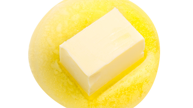 Butter melting against white background