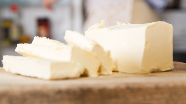 Butter in slices on board