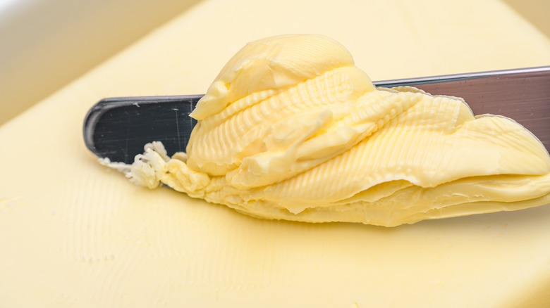 Butter being spread with knife