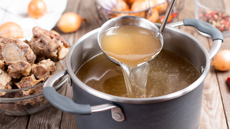 Pot of stock with ladle