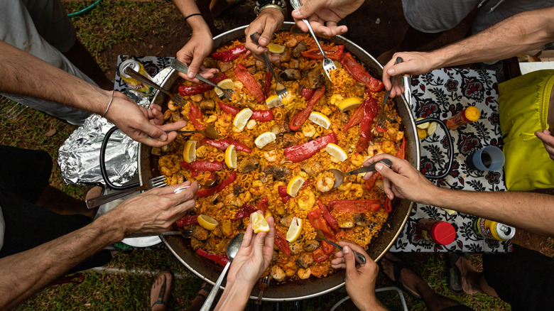 People eating paella