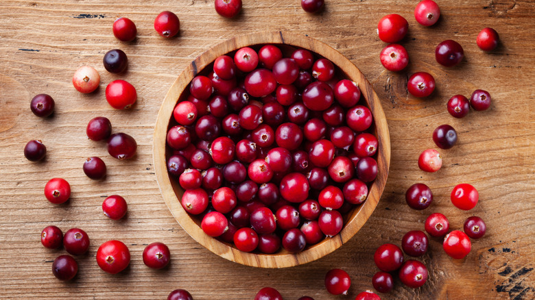 Red cranberries in wooden bowl 