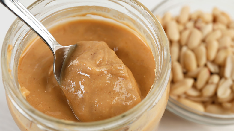 natural peanut butter on spoon