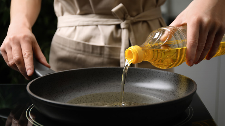 Oil pouring into pan