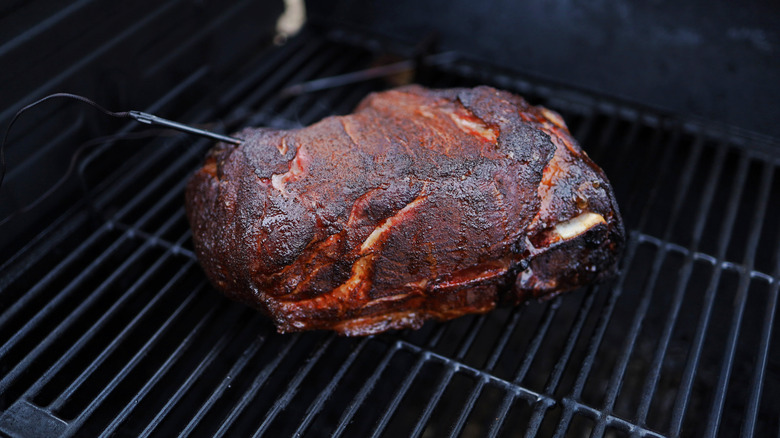 Pork butt in a smoker