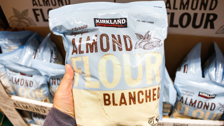 Person holding almond flour 