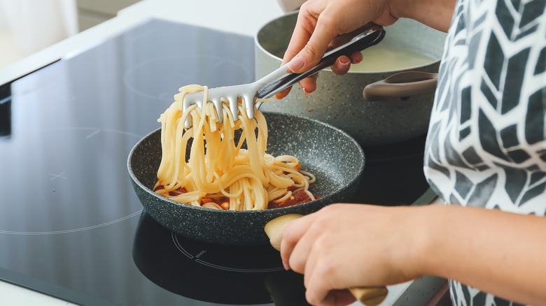 Pasta tongs and spaghetti