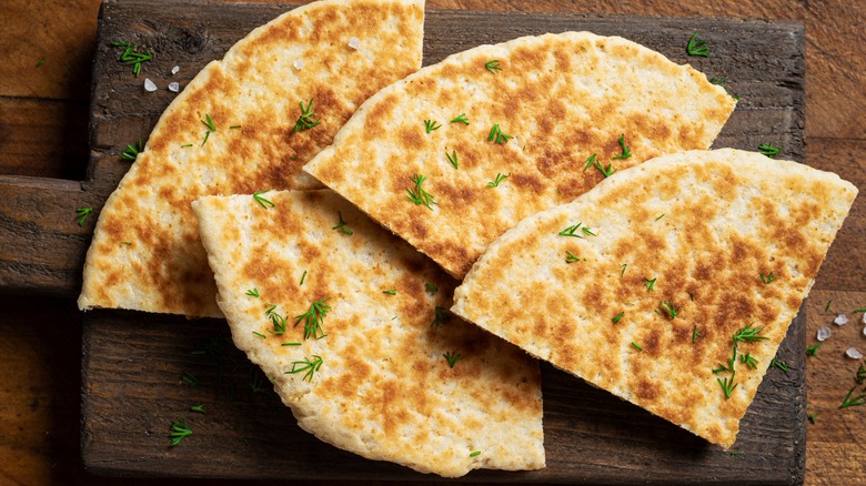 flatbreads on a wooden board