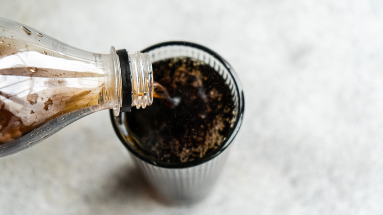 Pouring soda in a glass