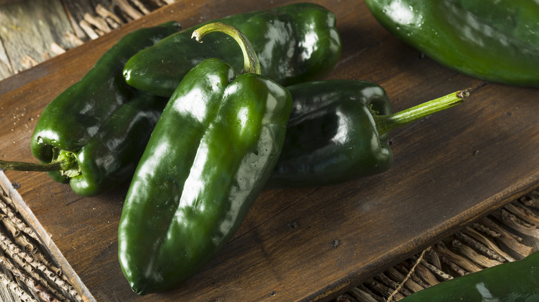 Poblano peppers on a chopping board