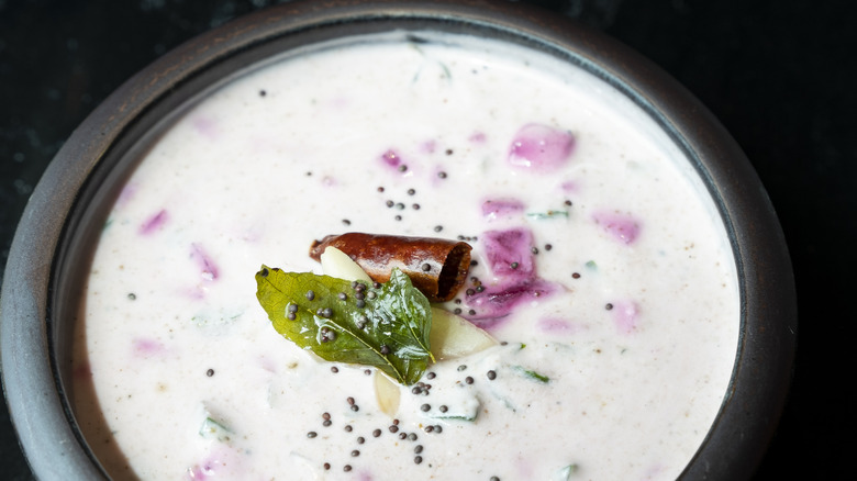 Creamy raita dressing in a bowl