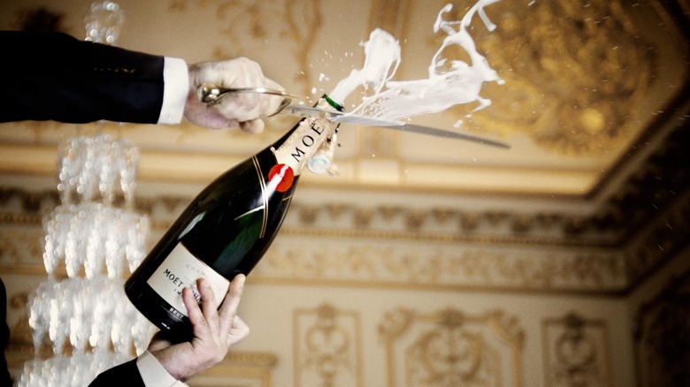 sabering Moët Champagne bottle