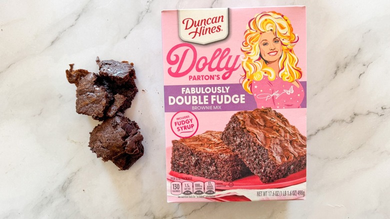 Duncan Hines Dolly Parton's brownie and boxed mix on marble background