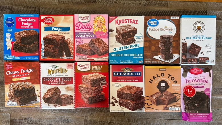 Boxes of different brownie mixes on wooden table