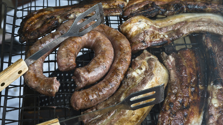 Cooking sausage on outdoor grill