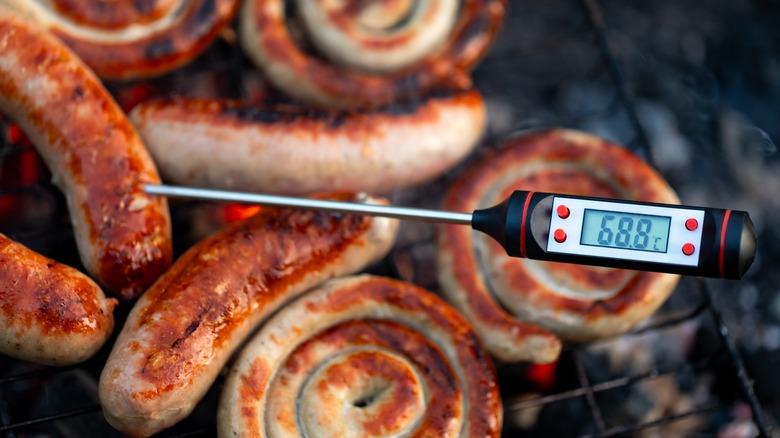 Grilled sausages on grill