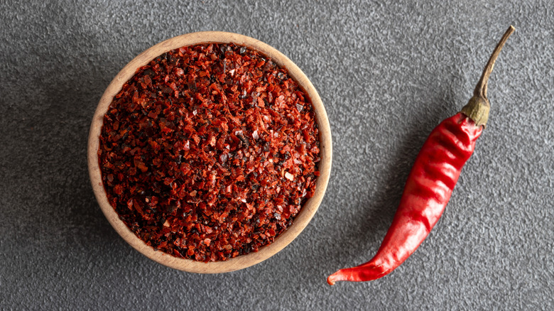 Bowl of red pepper flakes with dried chili