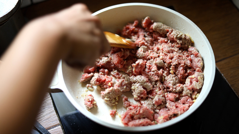 Frying ground beef in pan