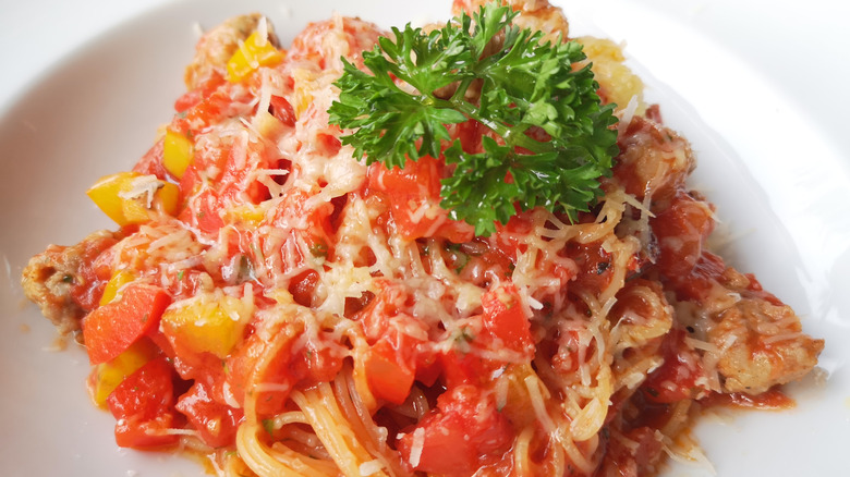 Angel hair pasta with tomato sauce, cheese, and fresh parsley