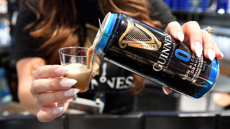 Pouring Guinness beer sample