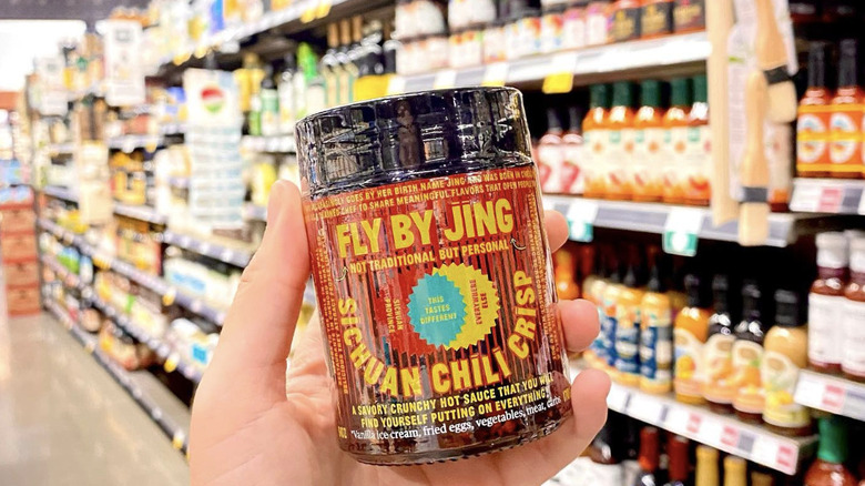 Fly By Jing Sichuan chili crisp held grocery store aisle