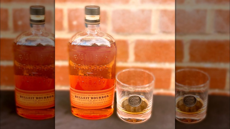 Bulleit bourbon bottle and glass