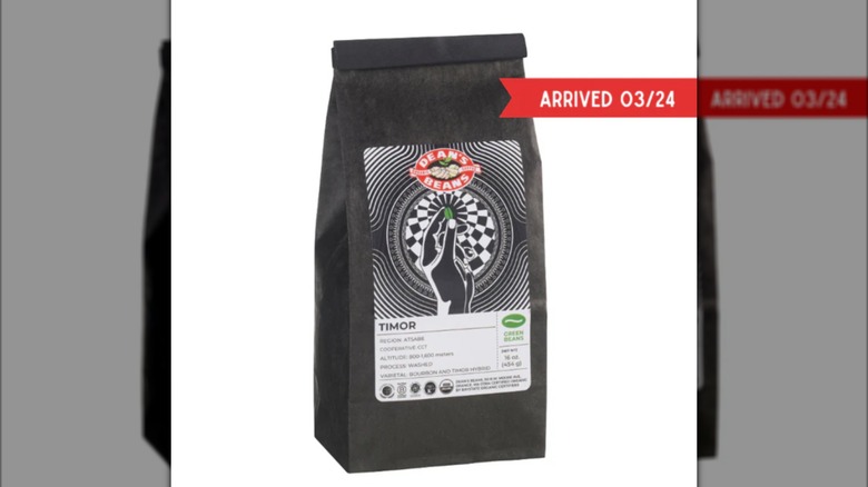 black bag of unroasted Timor beans from Dean's Beans on white background