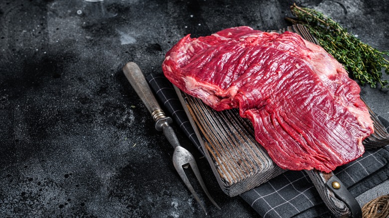 Flank steak on cutting board