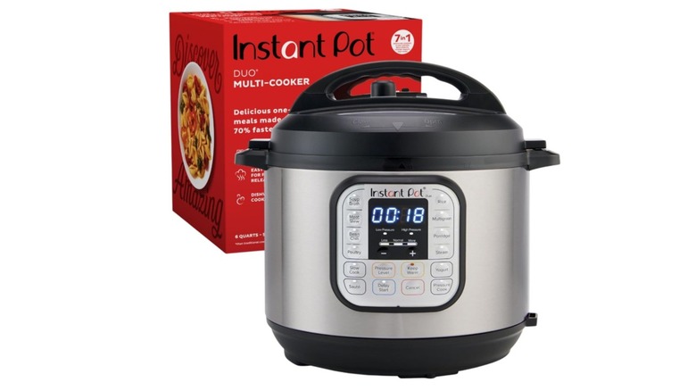 An Instant Pot Duo outside of the box on a white background