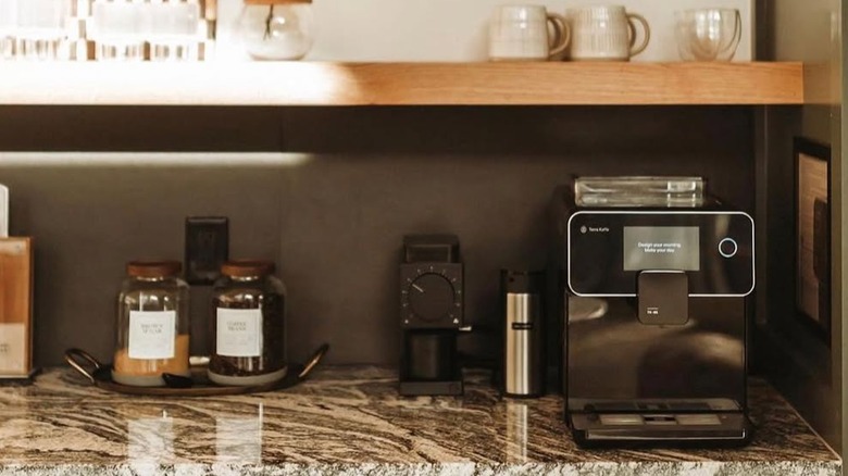 Image of a countertop displaying various products including black TK01 machine