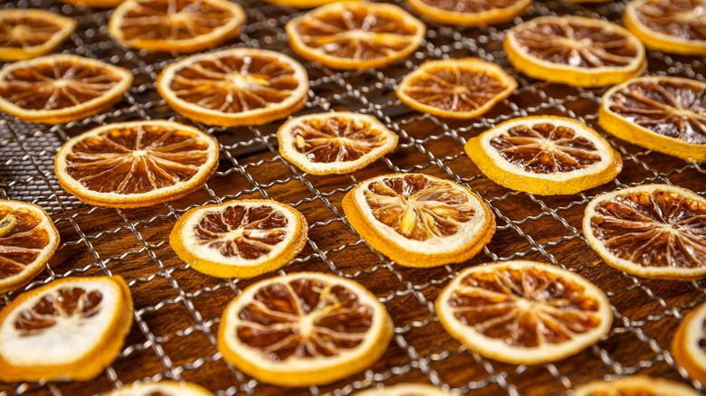 slices of candied oranges on a wire rack