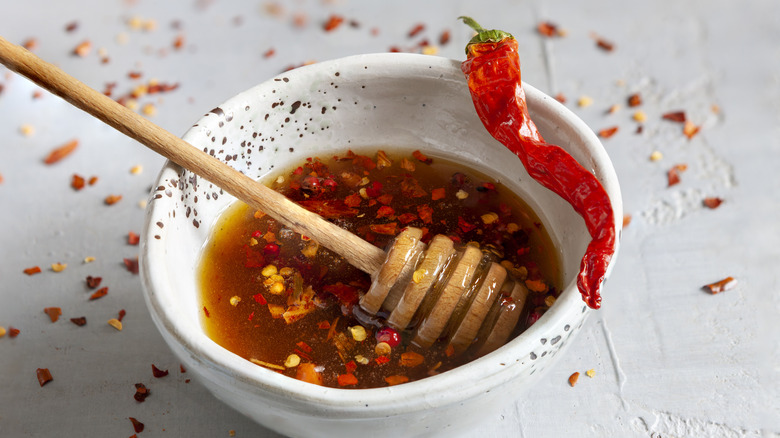 bowl of hot honey with chile garnish