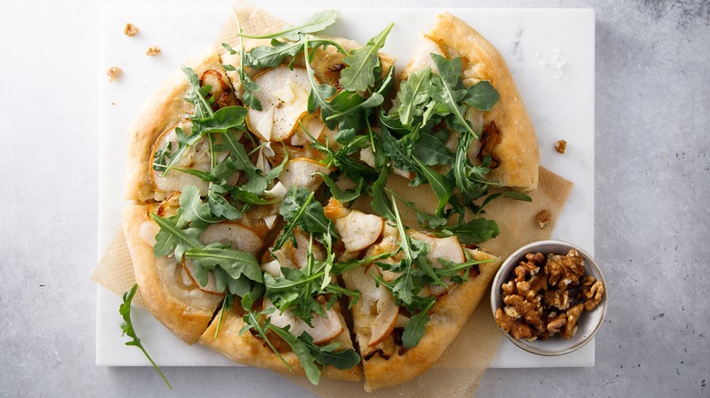 Pear arugula pizza