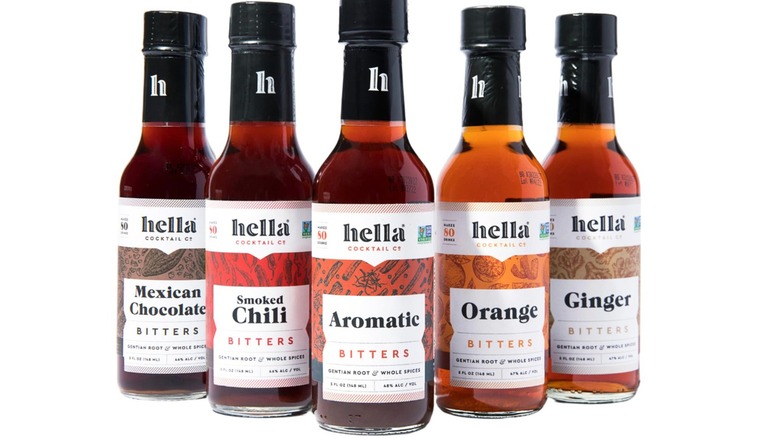 Five bottles of Hella Cocktail Co. bitters on white background