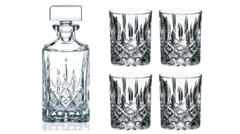 Riedel's decanter and whisky glass set on white background