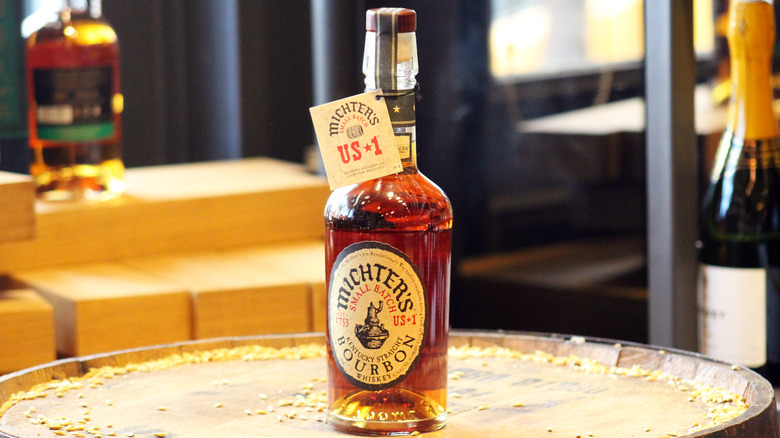 A bottle of Michter's US*1 bourbon on a barrel