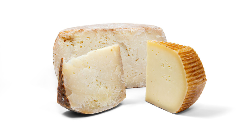 aged pecorino on white background