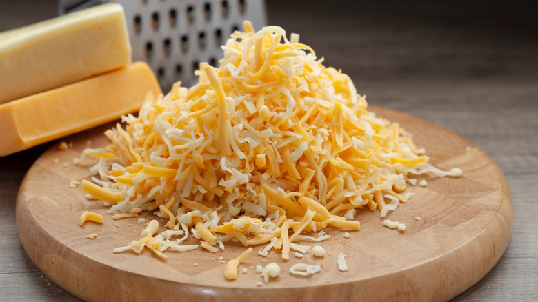 Pile of shredded cheddar cheese