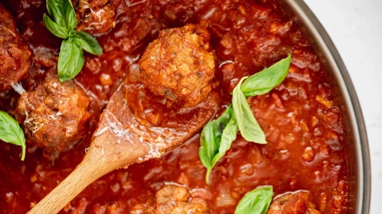 Meatballs in sauce with spoon