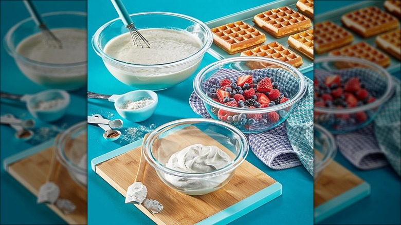 Three Pyrex mixing bowls near waffles