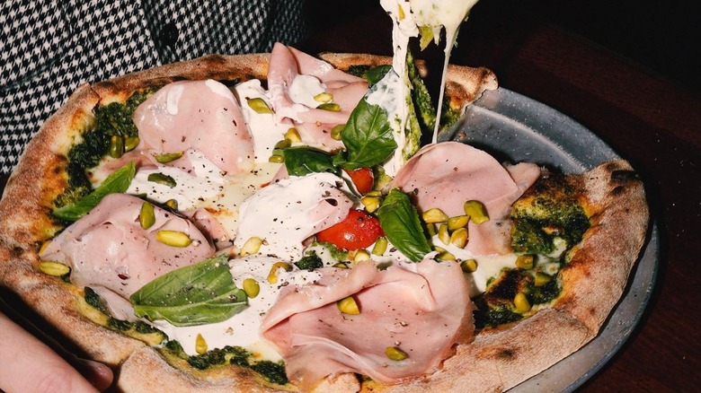 Pizza with mortadella and pistachios