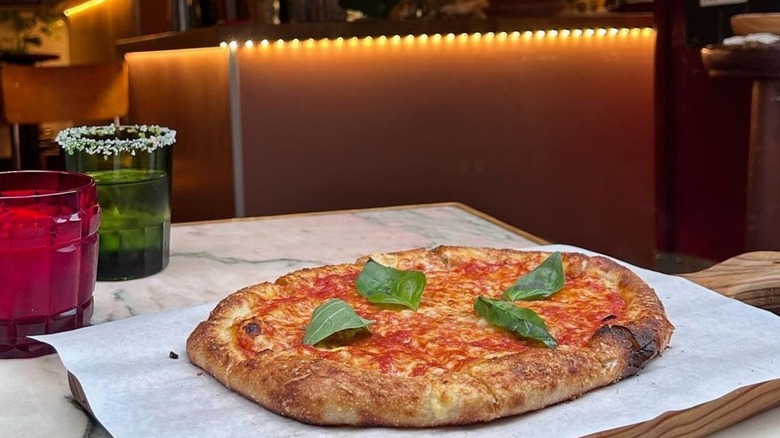 Margherita pizza with basil leaves